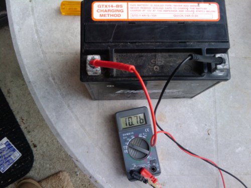 Low voltage of a badly sulfated lawn mower battery