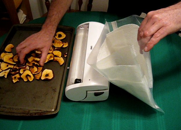 Line the vacuum sealer bag with paper towels