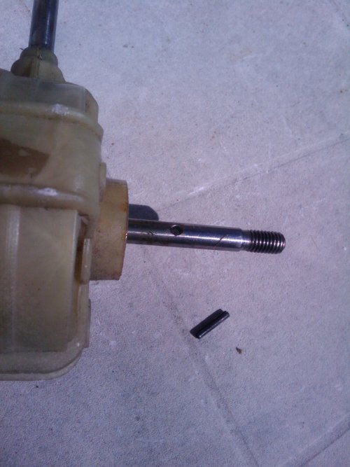 Remove the retaining pin from the armature shaft.